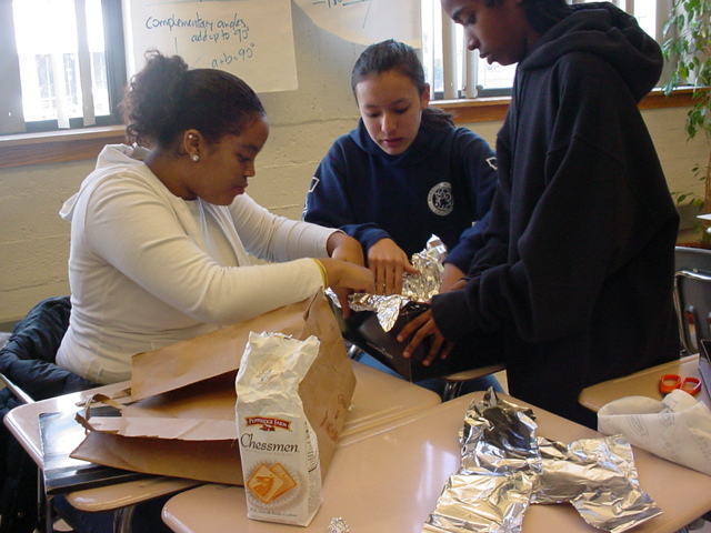 Students working together on a match project